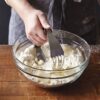 Woman using pastry blender